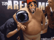 a pixel art of a man holding a camera in front of the word travis