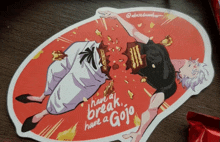 a sticker that says " have a break have a gojo " is on a table