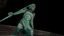 a woman in a green costume is holding a green sword .