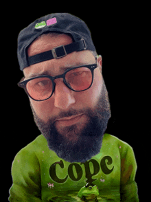 a man with a beard and glasses wears a green shirt that says copc