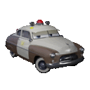 a brown and white police car from cars with a red light on top .