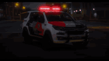 a police car with a red light on the top of it