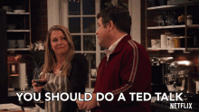 a man and a woman standing in a kitchen with the words " you should do a ted talk "