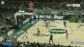 a basketball game is being played in front of a crowd with advertisements for stoix