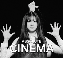 a black and white photo of a girl with the words absolute cinema