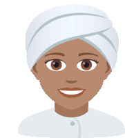 a woman with a white towel wrapped around her head smiles