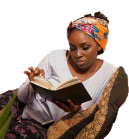 a woman wearing a head scarf is reading a book