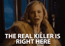 a woman wearing a fur coat says the real killer is right here