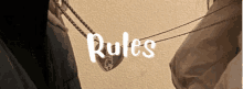 the word rules is on a wall next to clothes