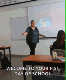 a woman stands in front of a whiteboard with the words welcome to your fist day of school written below her