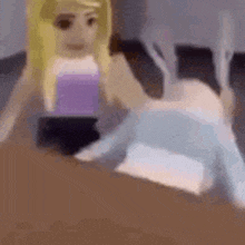 a girl in a purple top is laying on a bed next to a boy in a blue sweater .