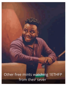 a man sitting on a couch with a caption that says other free mints watching 1ethfp