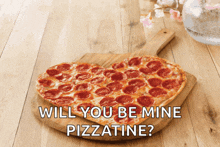 a heart shaped pepperoni pizza on a wooden cutting board with the words will you be mine pizzatine