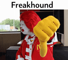 a mcdonald giving a thumbs down with the word freakhound above him