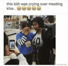 a woman with a 40 on her shirt is crying over a meeting