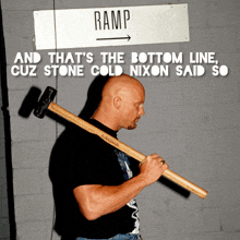 a man holding a large hammer in front of a sign that says ramp