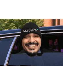 a man wearing a black beanie that says multivers on it