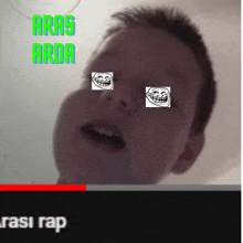 a video of a boy with troll faces on his eyes and the words " aras arda " above him