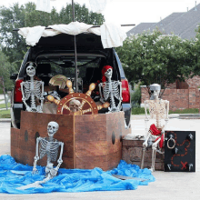 the trunk of a car is decorated to look like a pirate ship with skeletons