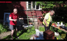 a man in a red shirt stands next to a man in a yellow vest with the word subik on the bottom