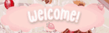 a pink sign that says welcome with strawberries in the background