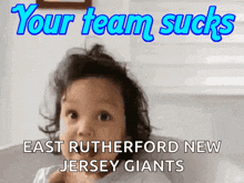 a little girl with the words your team sucks east rutherford new jersey giants on the bottom