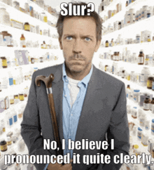 a man with a cane stands in front of a pharmacy shelf and says slur ?