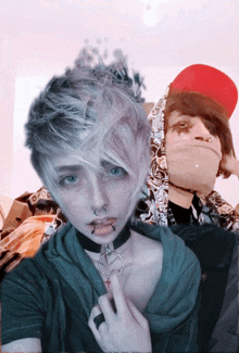 a girl with piercings and a choker stands next to a boy with a red hat