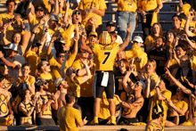 a football player with the number 7 on his jersey is surrounded by fans