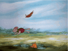 a cartoon pig running in a field with a leaf flying in the air