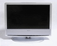 a sony tv is sitting on a white surface