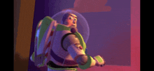 buzz lightyear from toy story standing in front of a pink wall