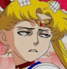 sailor moon from sailor moon is making a funny face .