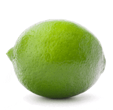 a green lime is sitting on a white background