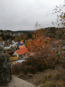 a small town with a blue building in the middle of it