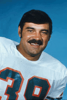 a man with a mustache wearing a number 30 jersey