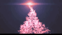 a pink christmas tree with a light coming out of the top of it