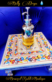 a bottle of belly drops soap sits on a table with a blue couch in the background