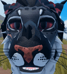 a close up of a leopard 's face with a red nose