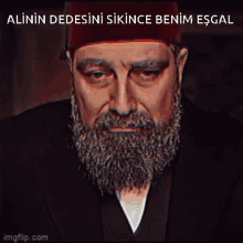 a man with a beard is wearing a hat and has the words alinin dedesini sikince benim esgal above him