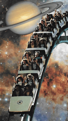 a roller coaster with people riding it with a planet in the background