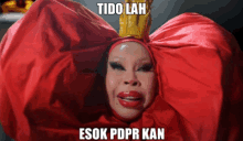 a woman in a red flower costume has the words tido lah esok pdpr kan above her head