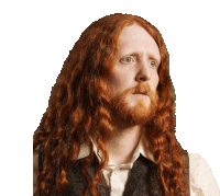 a man with long red hair and a beard is wearing a paisley vest