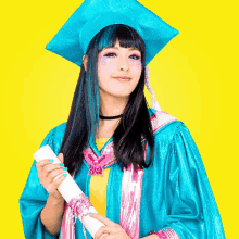 a woman wearing a graduation cap and gown holds a diploma