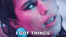 a close up of a woman 's face with the words " i got things " above her