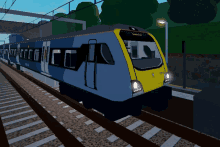 a blue and yellow train with the word swindon on the front of it