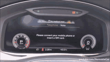 a car dashboard displays a message asking you to connect your phone or insert a sim card