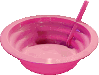 a pink bowl with a spoon and straw in it