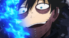 a close up of a person 's face with blue flames coming out of it