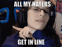 a woman wearing glasses and headphones has a meme on her face that says all my haters get in line